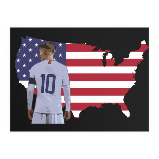 Front view of Christian Pulisic in USMNT kit in front of USA themed background of flag inside country outline poster.