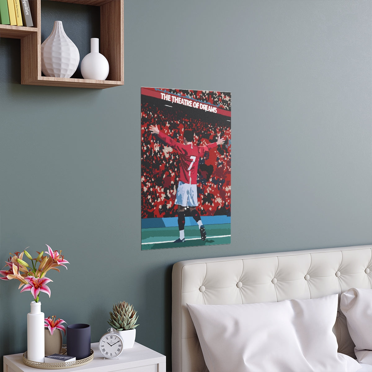 Contextual Front view of Manchester United Cristiano Ronaldo celebrating in front of Old Trafford crowd on a poster hanging above a double bed.