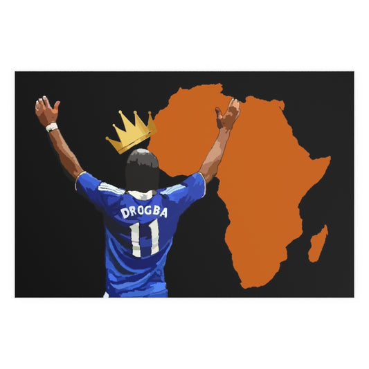 Front view of Chelsea Didier Drogba with a crown a top his head with the orange coloured continent of Africa on a hanging poster.