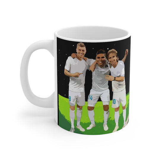 Side on view of ceramic mug featuring design of Casemiro, Kroos and Modric. 