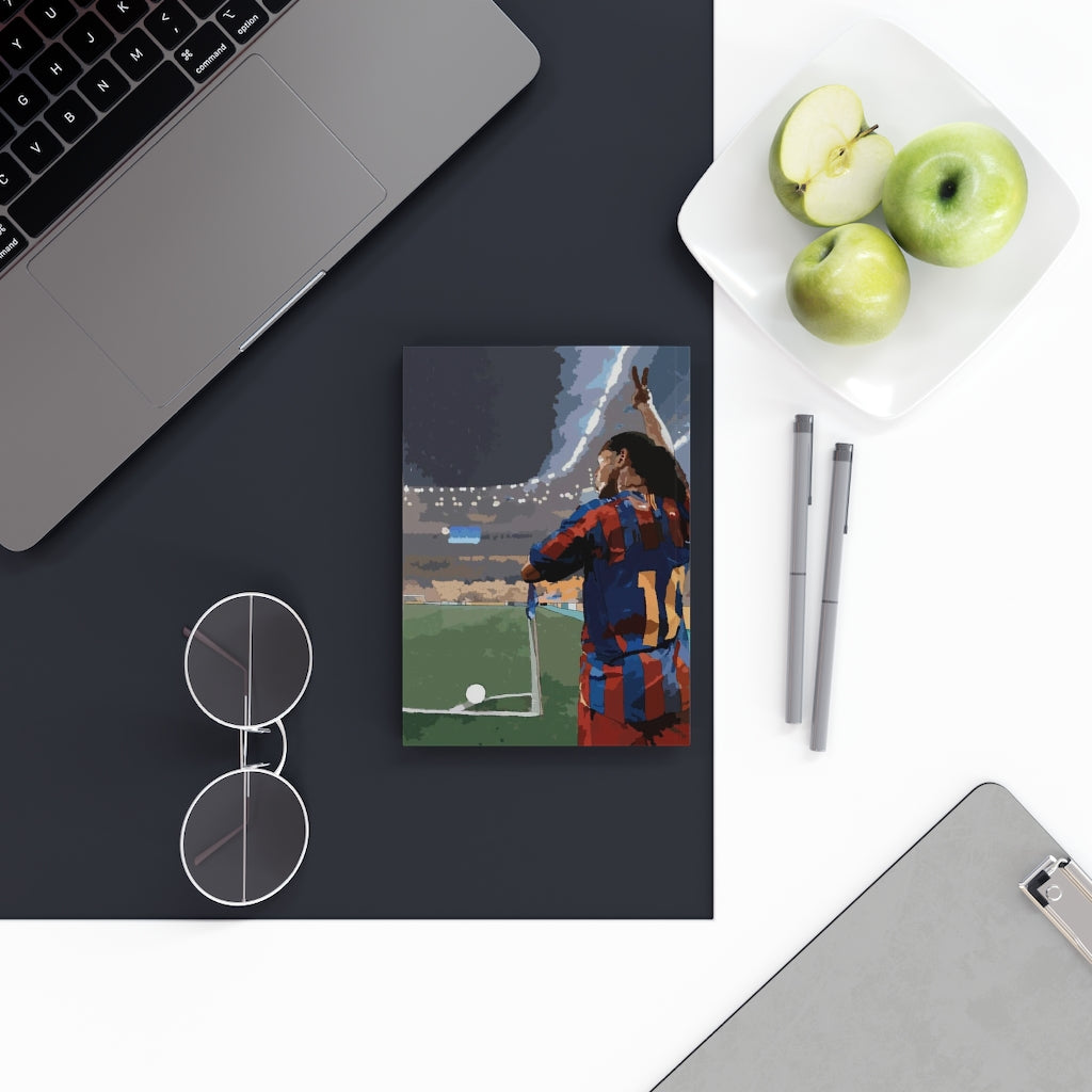 Contextual image of Barcelona Ronaldinho football themed notepad on top of a desk 