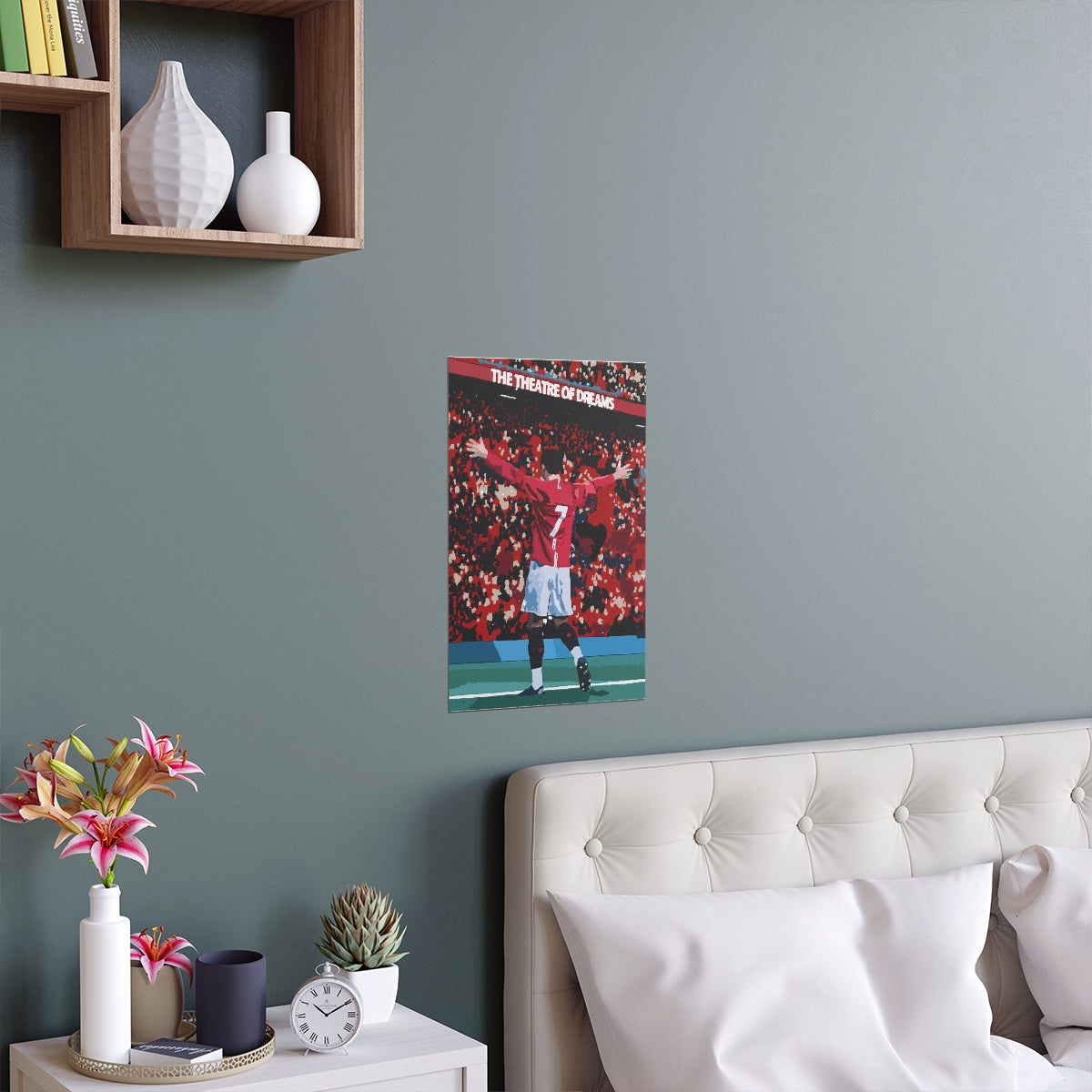 Contextual Front view of Manchester United Cristiano Ronaldo celebrating in front of Old Trafford crowd on a poster hanging above a double bed.