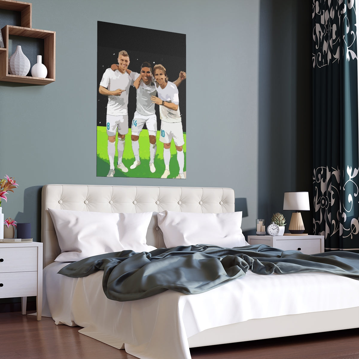 Contextual Front view of Toni Kroos, Casemiro and Luka Modric arm in arm on a black poster hanging on a wall above a double bed.